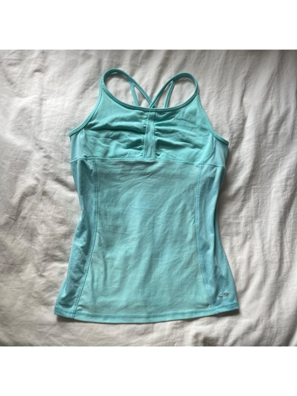 Teal sporty tank top with criss-cross straps